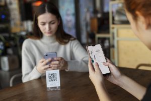 Two people looking at an online menu.