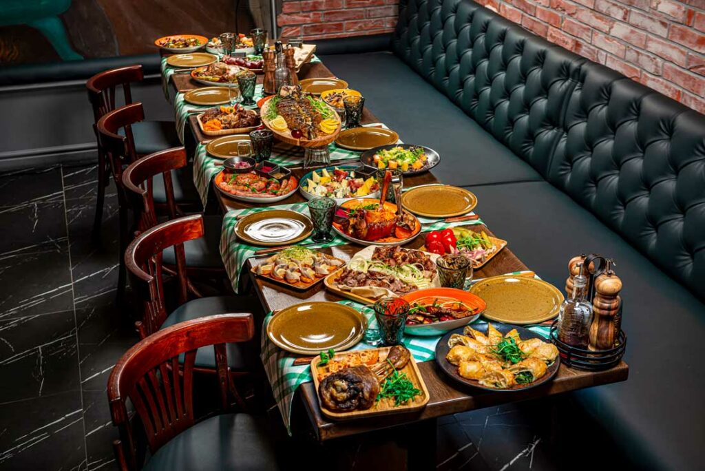 a restaurant table with food on a table