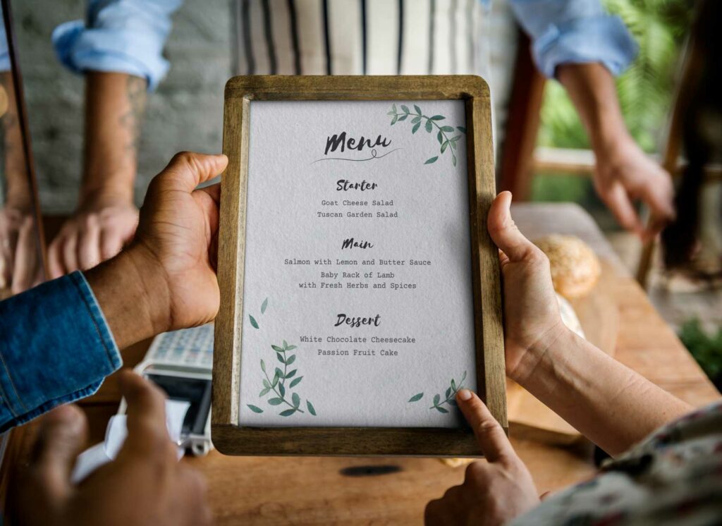 someone holds a restaurant menu